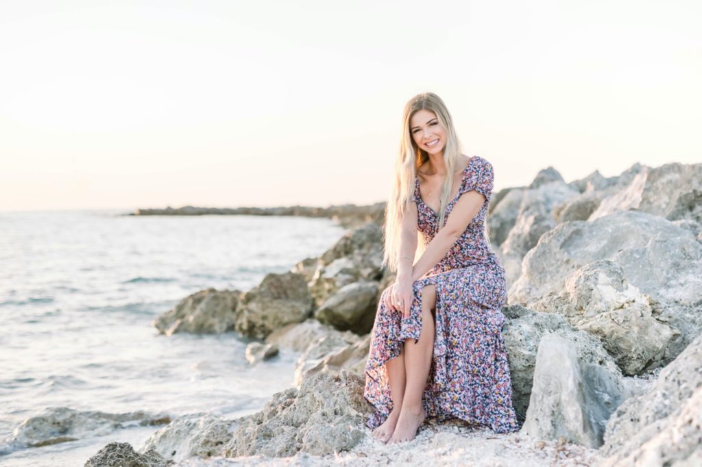 Senior photo for lexi on the beach and sitting on the rock
