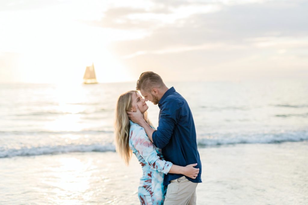 Dreamy couple on the sunset beach engagement session