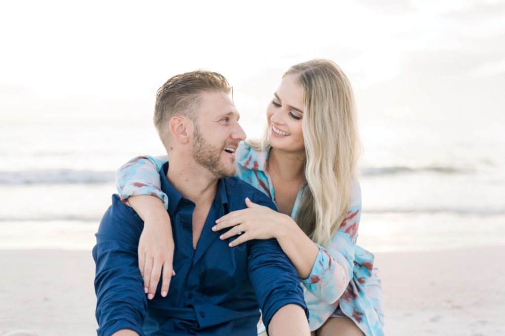 Couple look at each other on their engagement session.