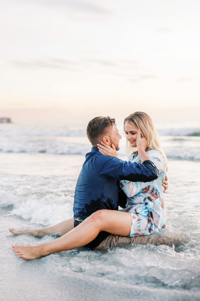 Romantic couple on their beach sunset engagement session.