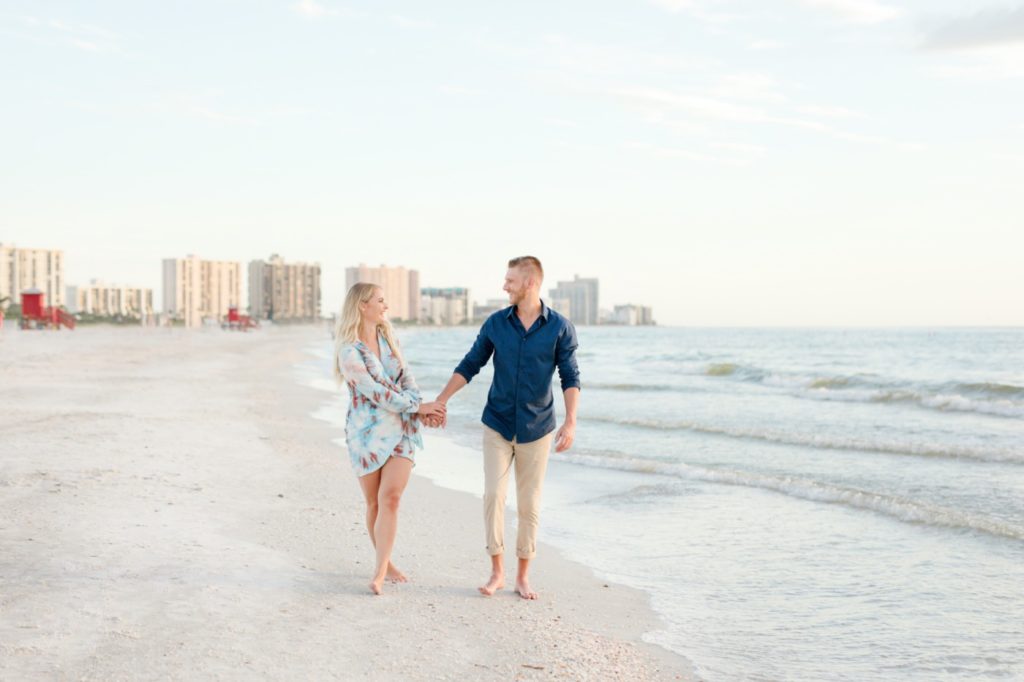 Walking on the dreamy sunset beach engagement session.