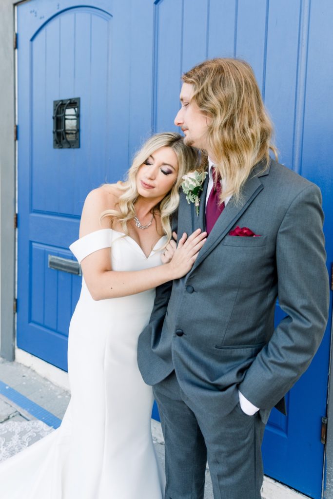 Romantic bride and grooms in front of  the blue door at Rialto Theatre Wedding Venue Downtown Tampa