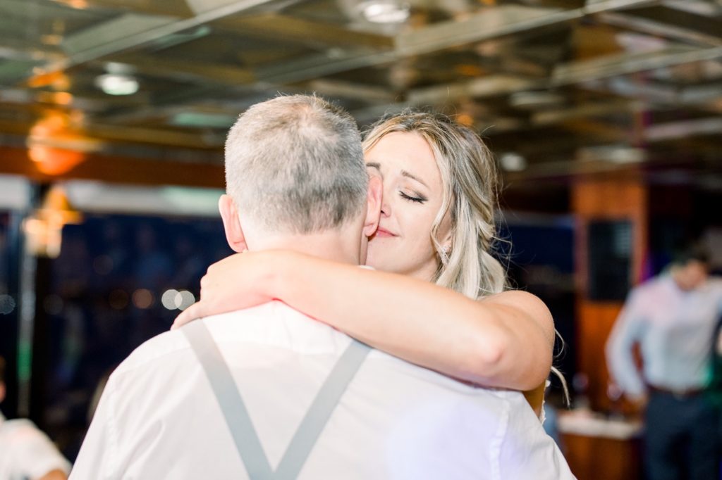 Dad and daughter dance on the Yacht StarShip IV Sunset Cruise