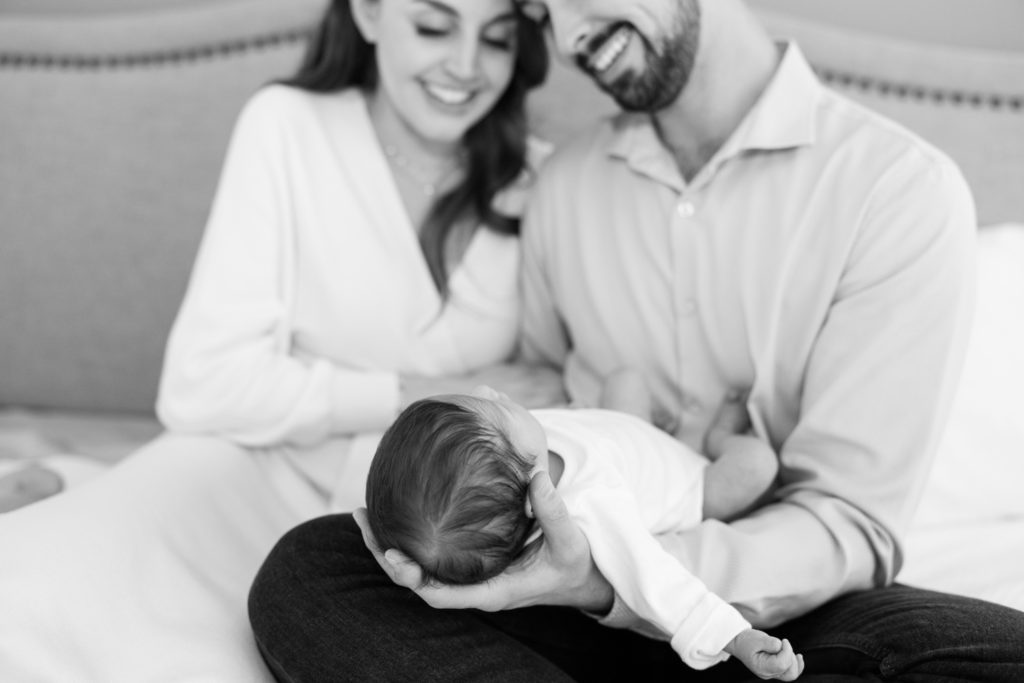 Black and White Portrait of a family of three with a newborn by Jommy Photography. newborn photography Florida #JommyPhotography #JommyFamilies #FloridaFamilyPhotography #Familyphotographers #professionalphotographers #familyportraits