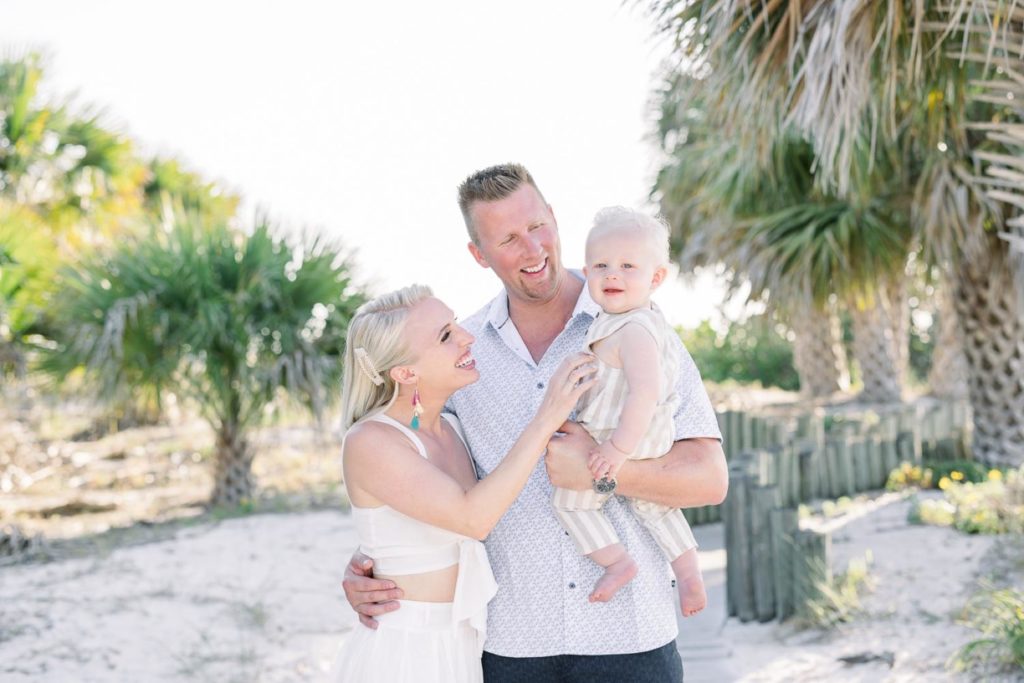 Jommy Photography captures a family portrait with a blonde little boy on a beach in Florida. blonde baby blonde momma #JommyPhotography #JommyFamilies #FloridaFamilyPhotography #Familyphotographers #professionalphotographers #familyportraits